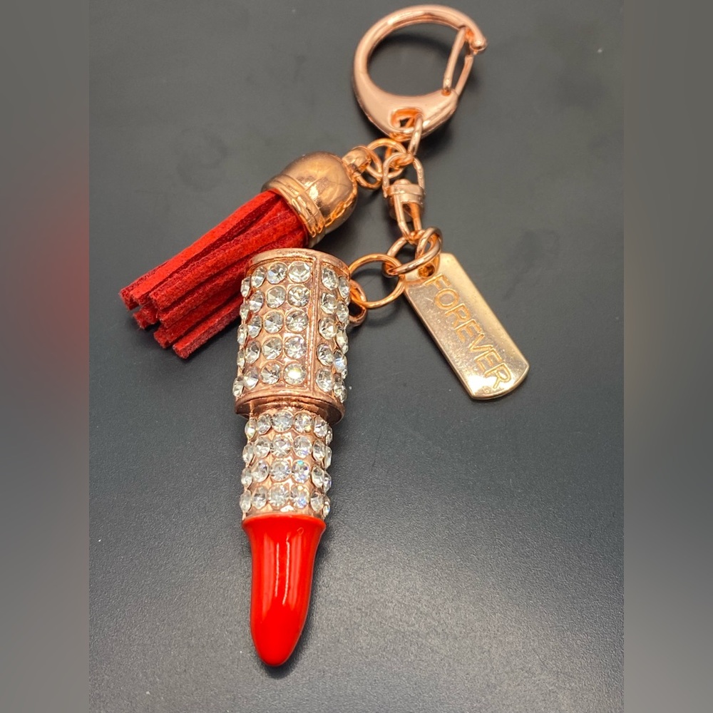 Red rose gold livestock crystal keychain with a tag the says forever
